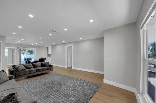 a living room with furniture and a rug