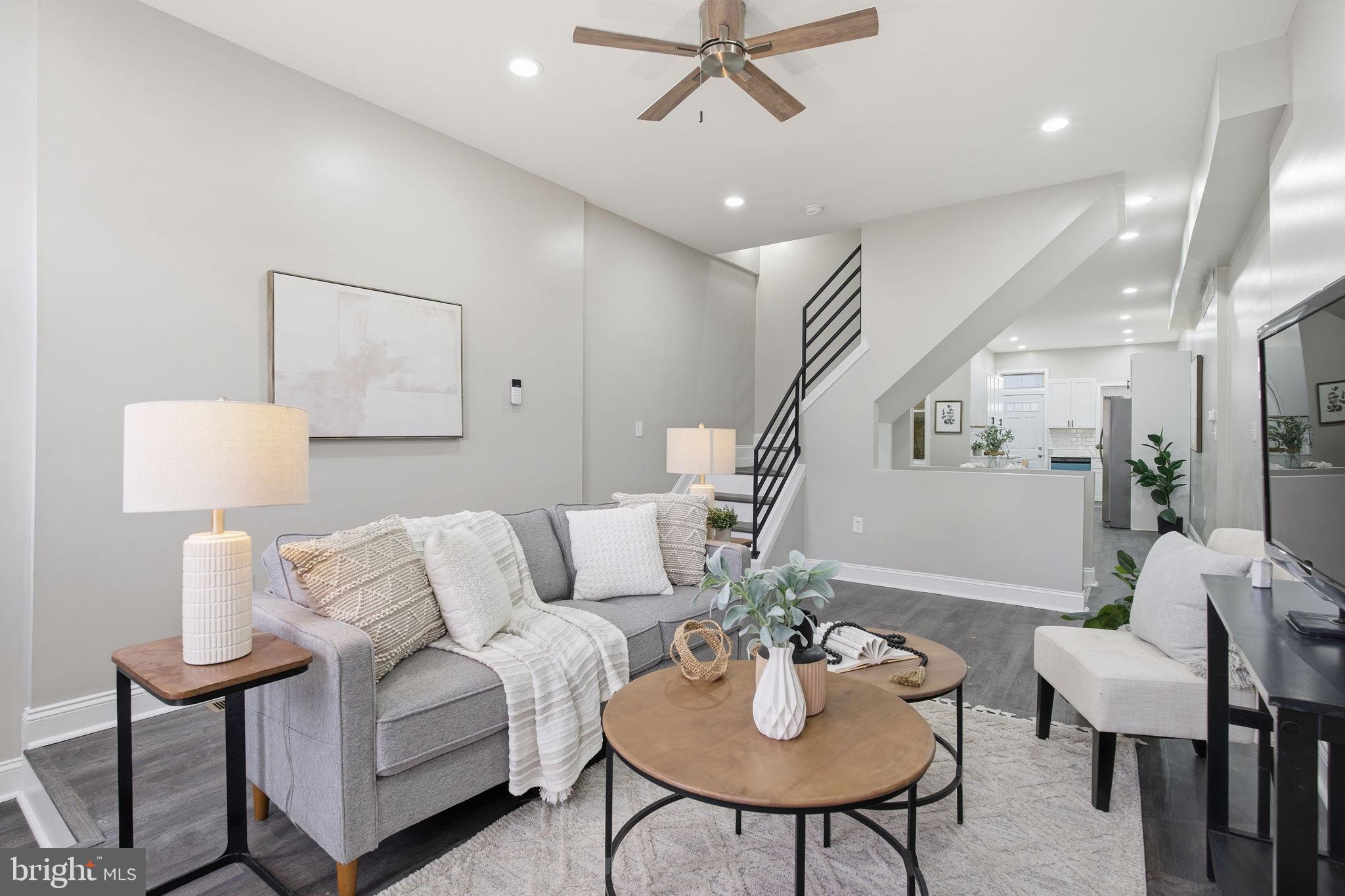 1708 Federal Street Baltimore, MD 21213 - Photo 1 of 33 a living room with furniture and a potted plant