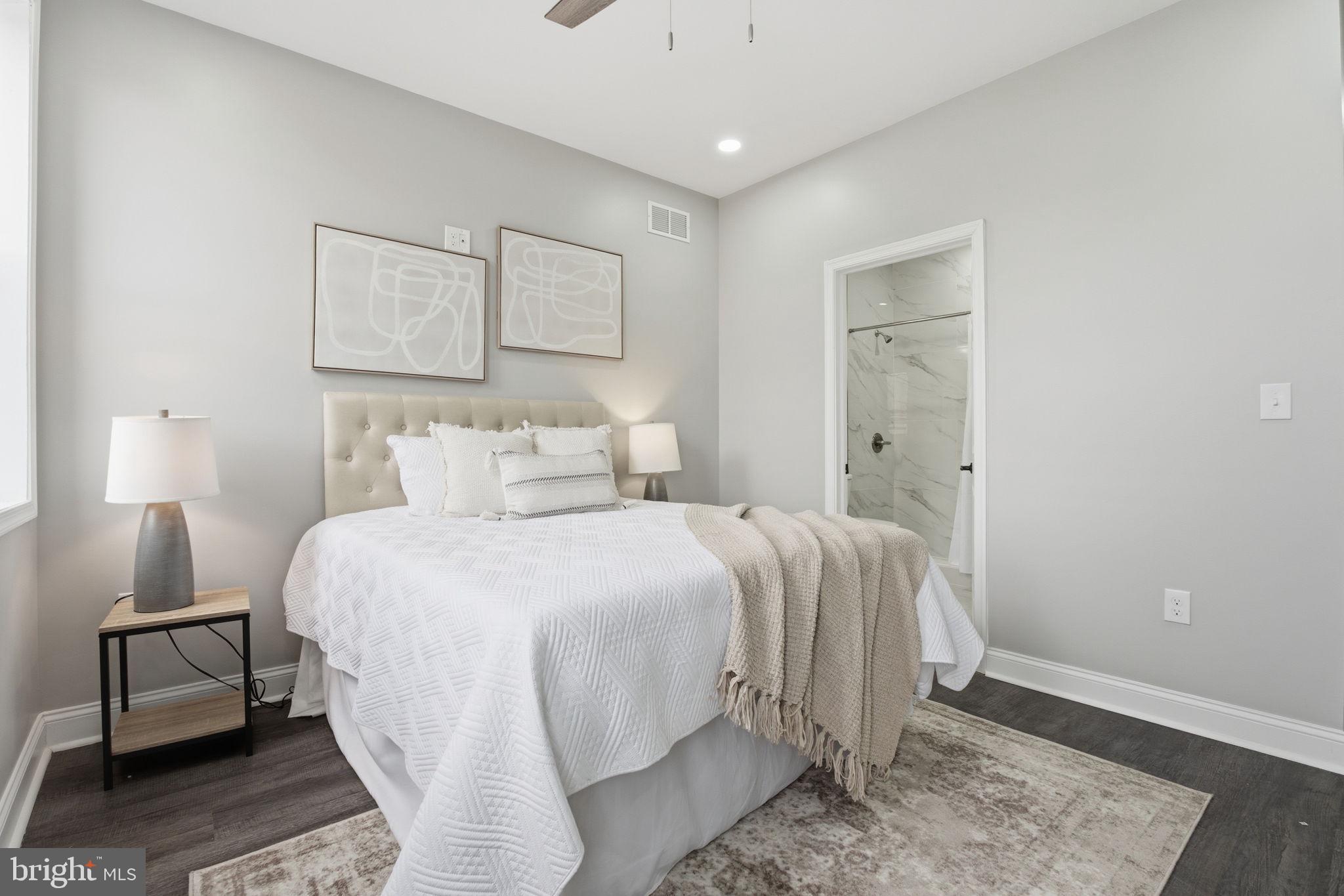 1708 Federal Street Baltimore, MD 21213 - Photo 15 of 33 a spacious bedroom with a bed and wooden floor