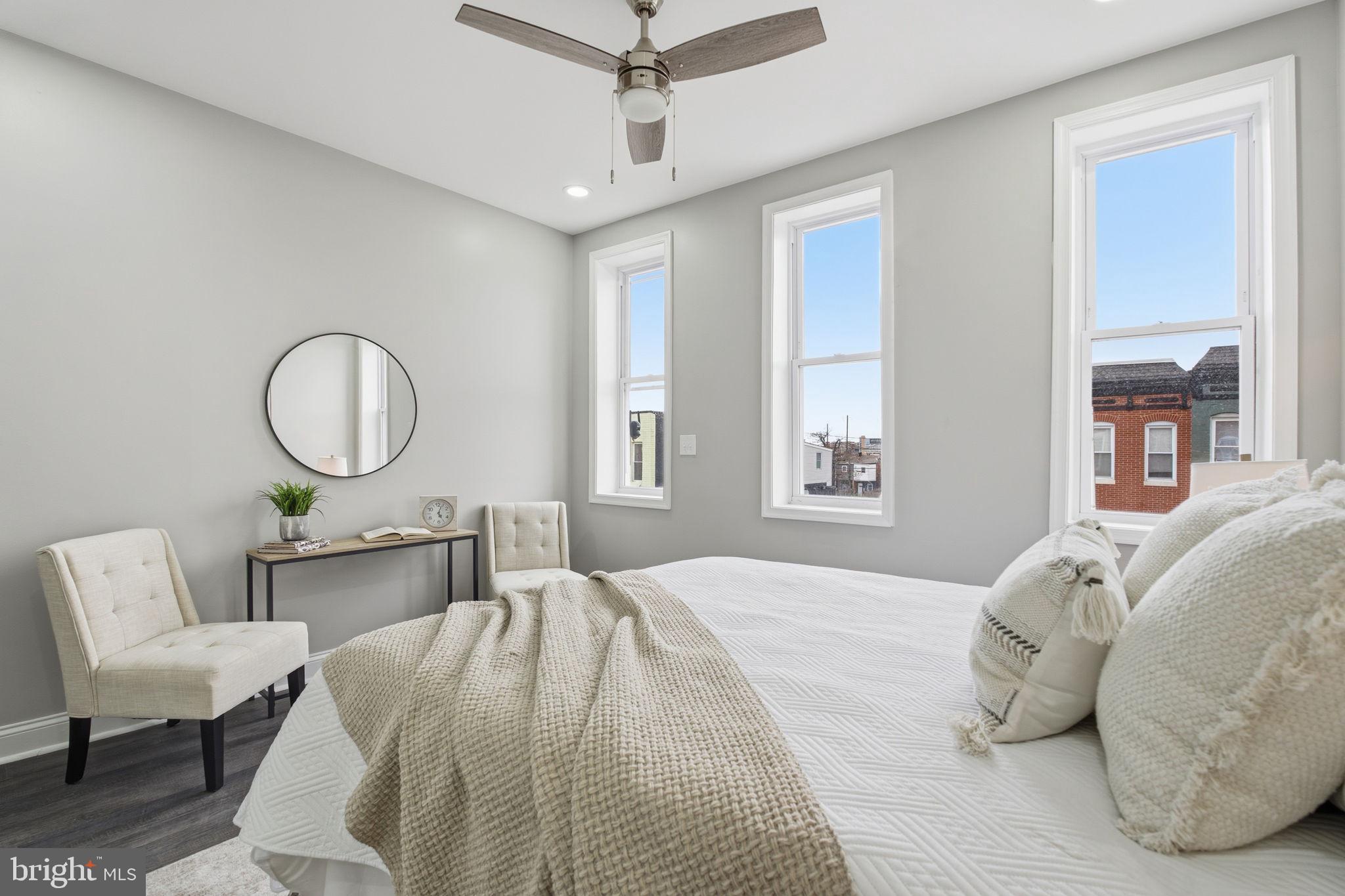 1708 Federal Street Baltimore, MD 21213 - Photo 17 of 33 a bedroom with a bed and window