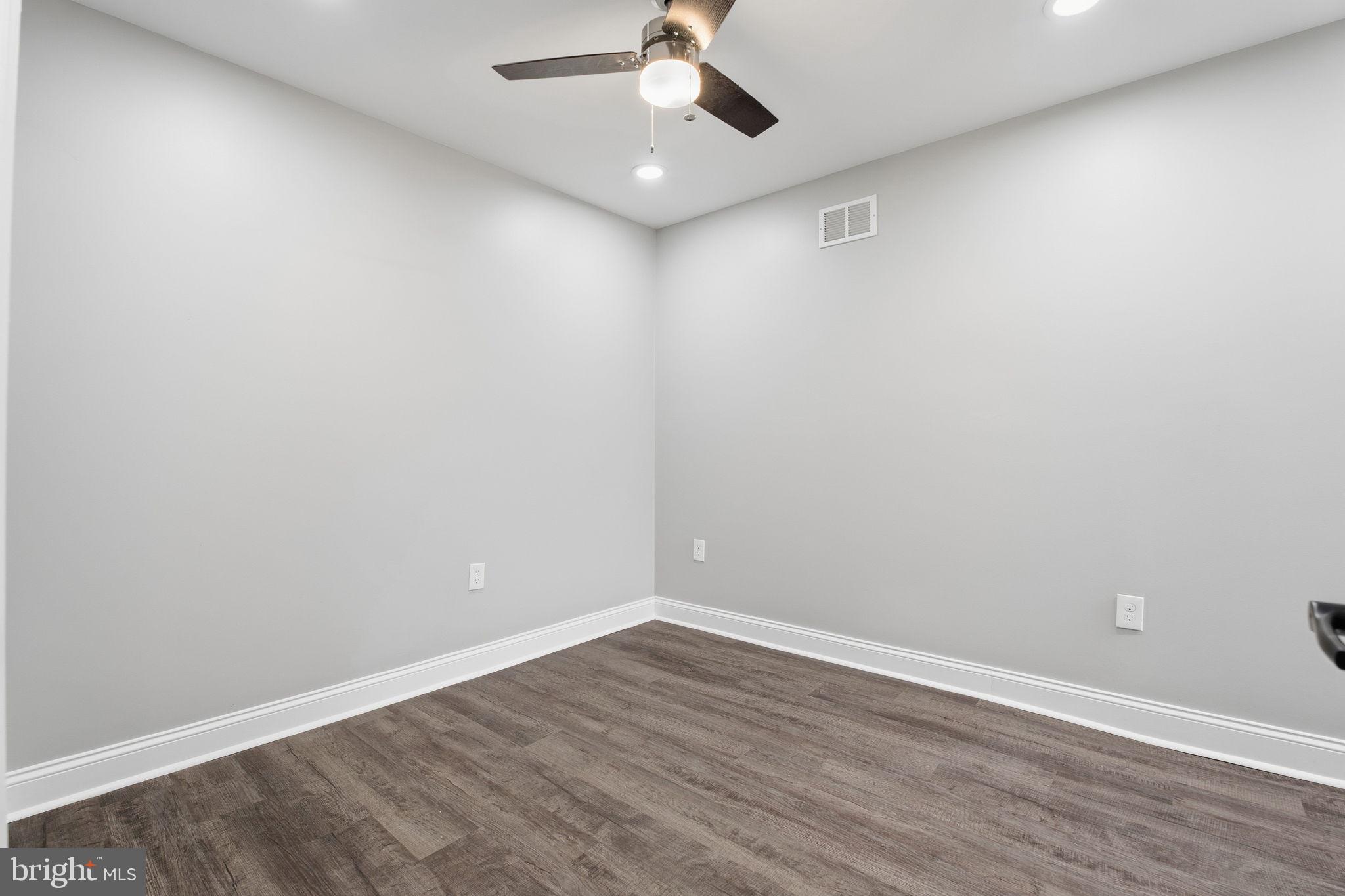 1708 Federal Street Baltimore, MD 21213 - Photo 19 of 33 wooden floor in an empty room