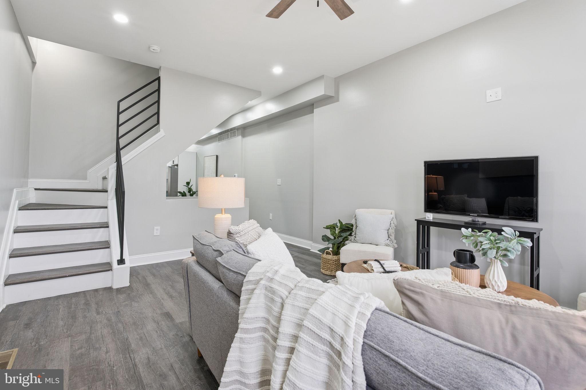 1708 Federal Street Baltimore, MD 21213 - Photo 3 of 33 a bedroom with a bed and flat screen tv