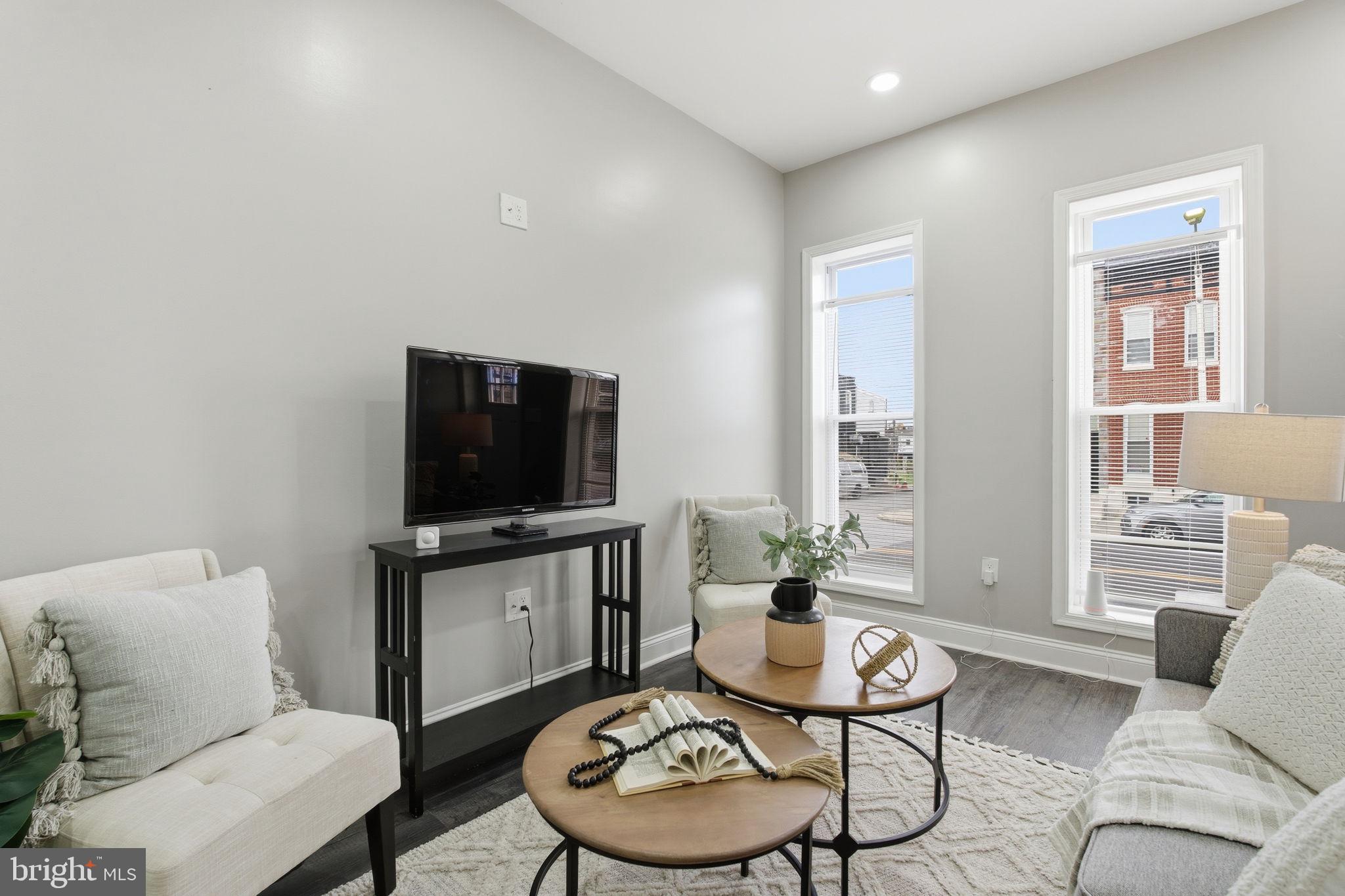 1708 Federal Street Baltimore, MD 21213 - Photo 4 of 33 a living room with furniture and a flat screen tv