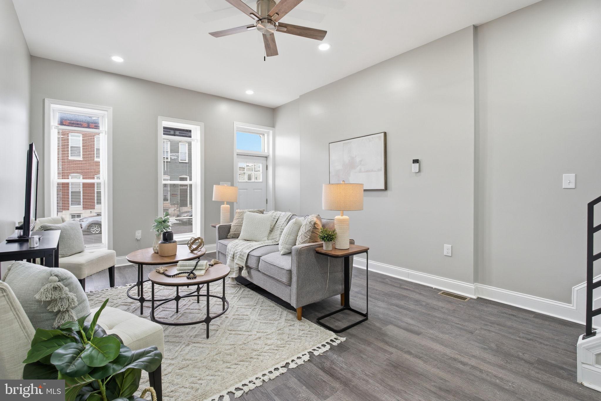 1708 Federal Street Baltimore, MD 21213 - Photo 5 of 33 a living room with furniture and wooden floor