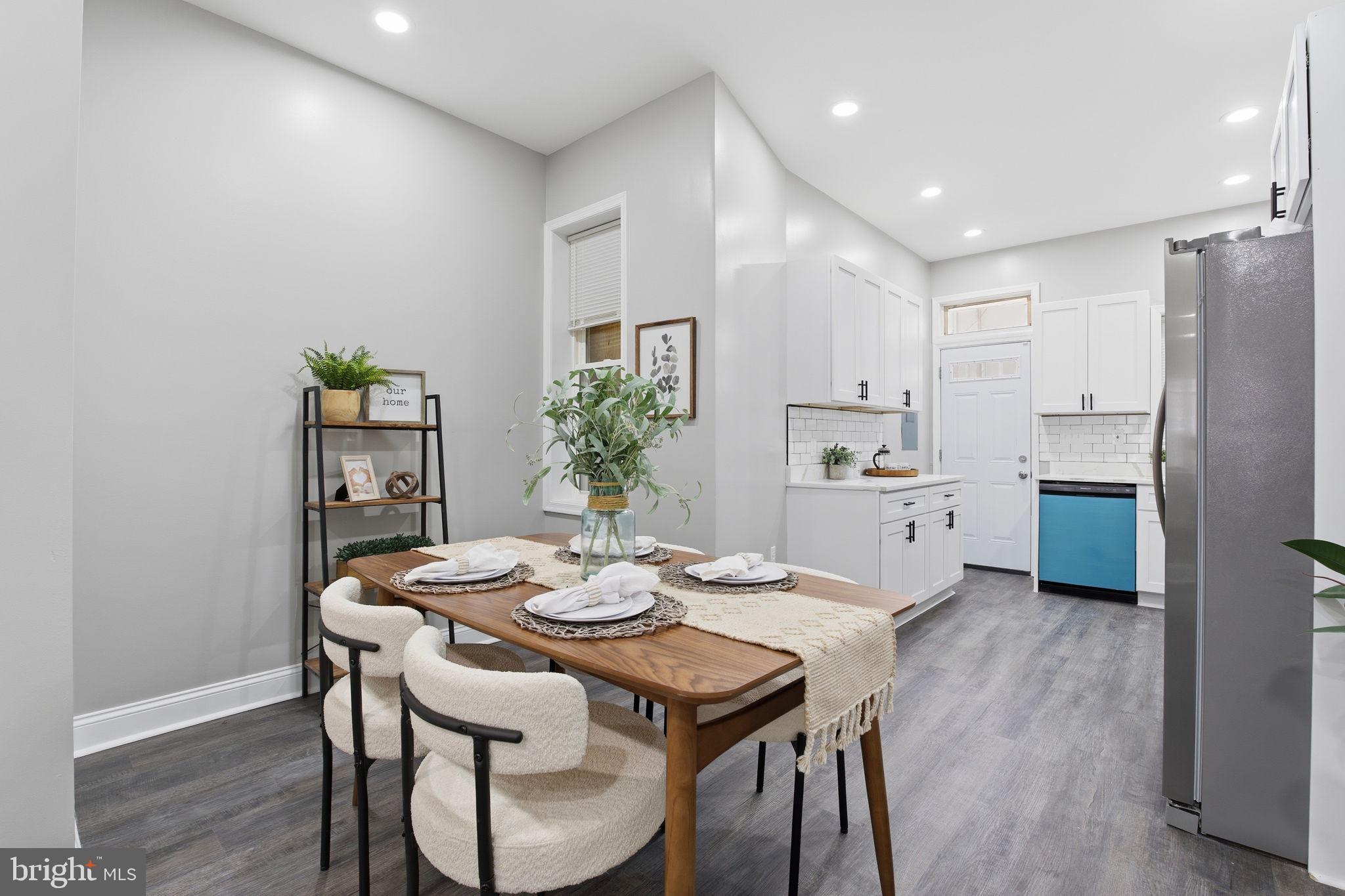 1708 Federal Street Baltimore, MD 21213 - Photo 6 of 33 a kitchen with a table and chairs in it