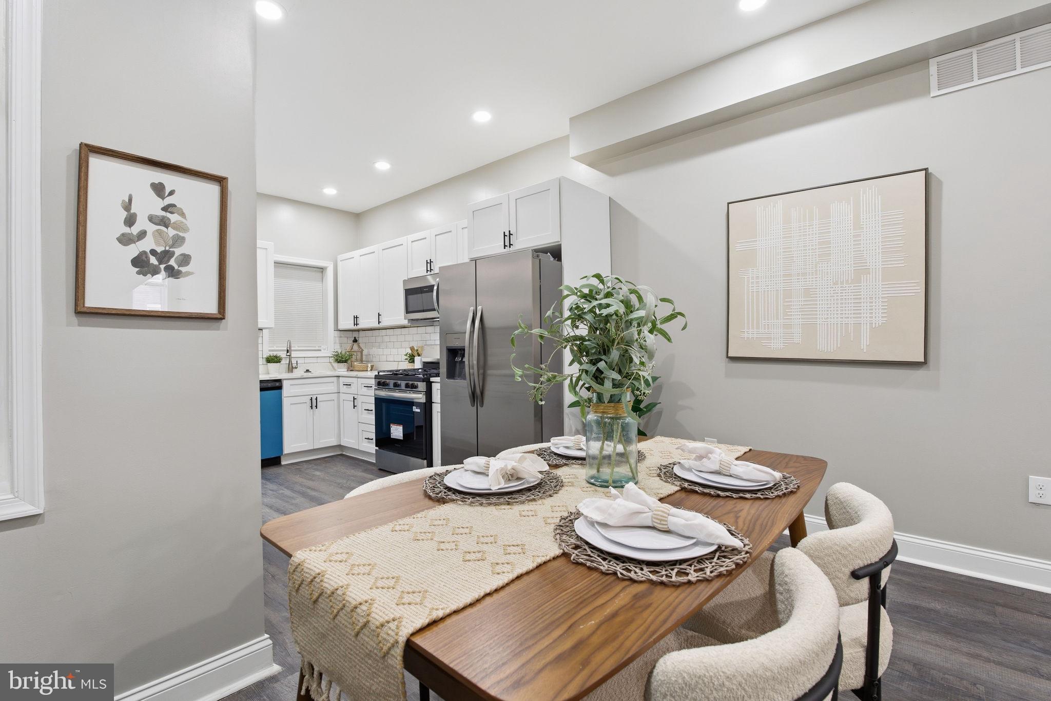 1708 Federal Street Baltimore, MD 21213 - Photo 8 of 33 a kitchen with a table and chairs in it