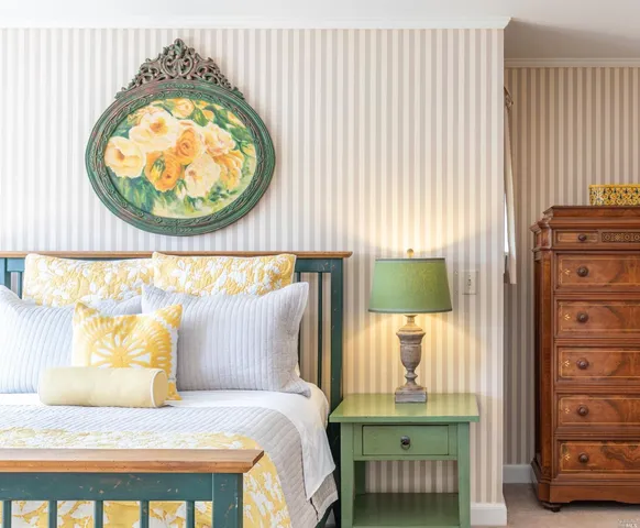 a bedroom with a bed and a lamp