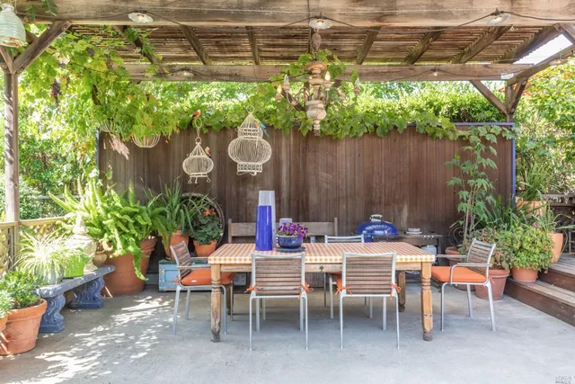 a view of a chairs and table in a patio