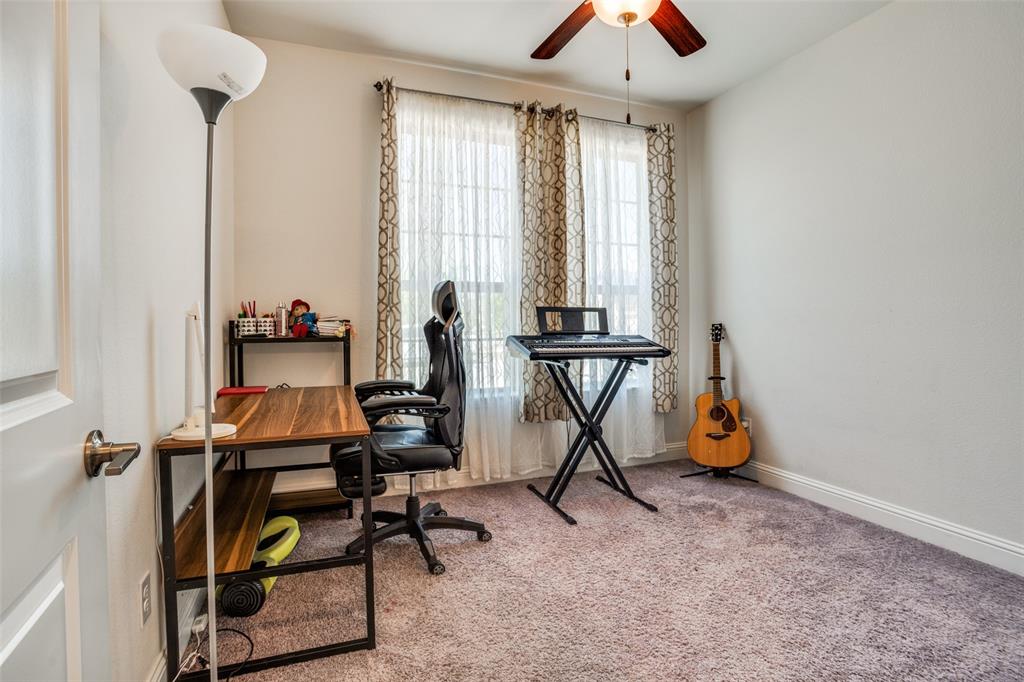 16380 Radstock Road Frisco, TX 75033 - Photo 15 of 39 Home office with light colored carpet and a ceiling fan