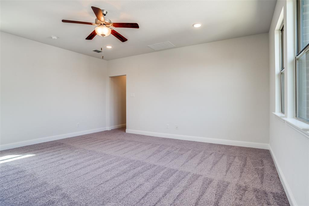 16380 Radstock Road Frisco, TX 75033 - Photo 17 of 39 Empty room featuring light colored carpet, a ceiling fan, and recessed lighting