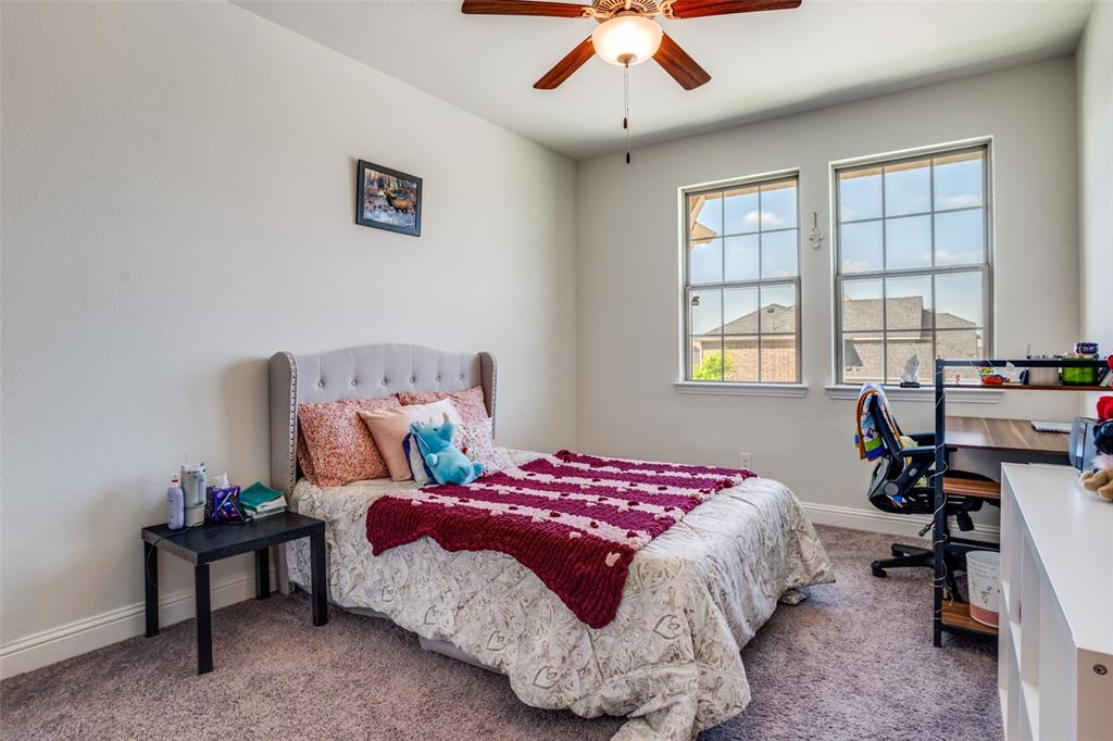 16380 Radstock Road Frisco, TX 75033 - Photo 21 of 39 Bedroom featuring carpet floors, an office area, and ceiling fan