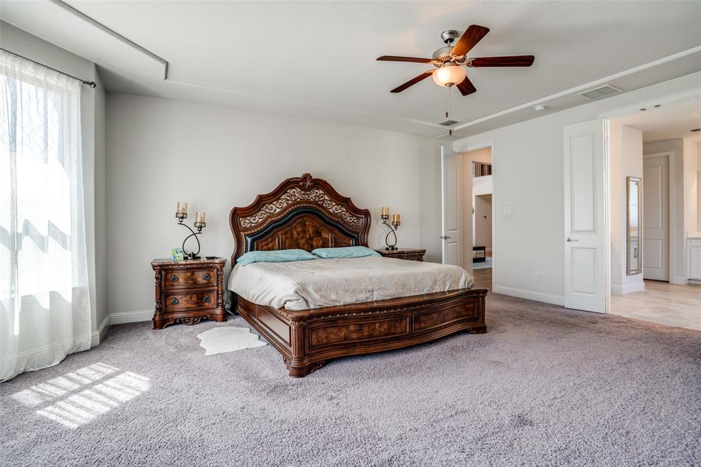 16380 Radstock Road Frisco, TX 75033 - Photo 26 of 39 Bedroom featuring light carpet and a ceiling fan