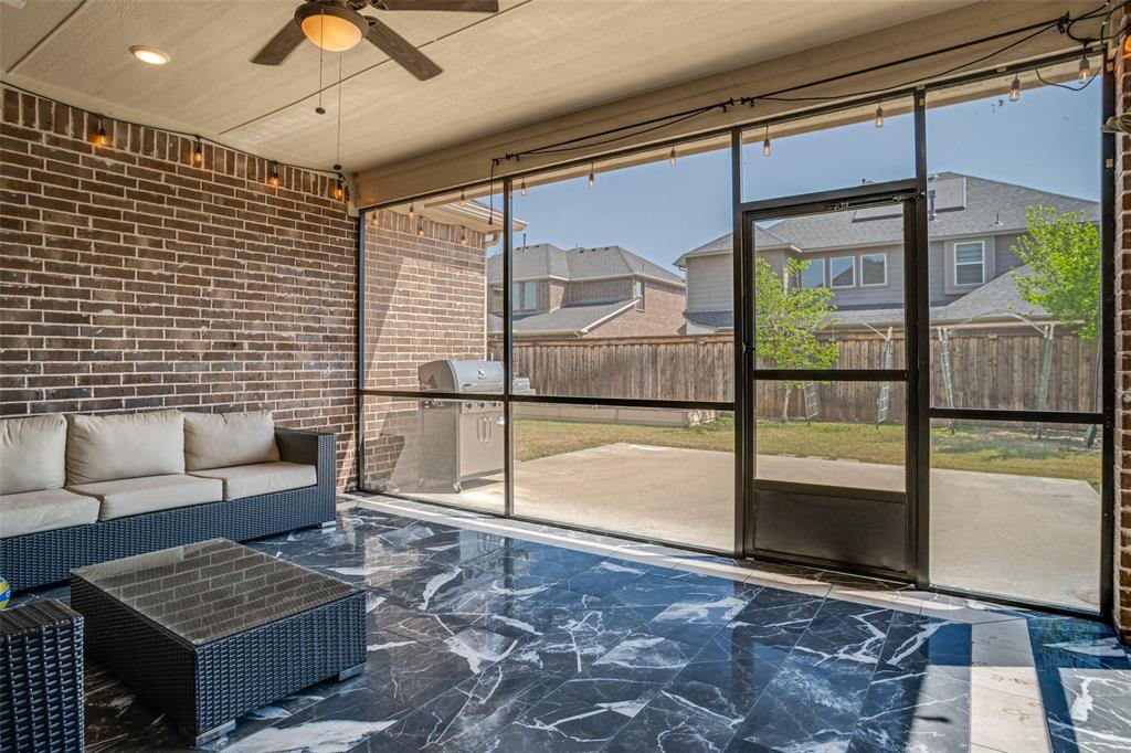 16380 Radstock Road Frisco, TX 75033 - Photo 29 of 39 Unfurnished sunroom with an outdoor hangout area, ceiling fan, and healthy amount of natural light
