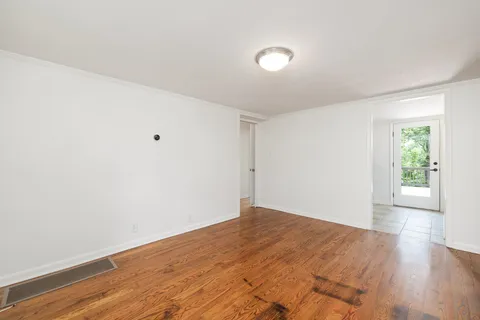 a view of a house with a backyard