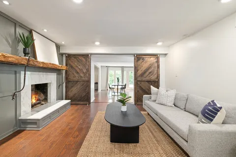 a front view of a house with a garden