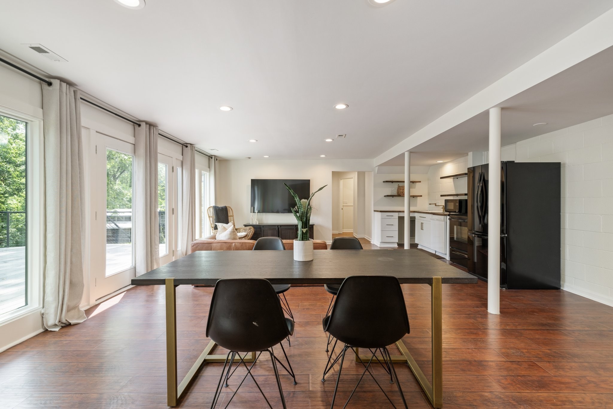 1116 Sparta Road Nashville, TN 37205 - Photo 52 of 91 a kitchen with stainless steel appliances granite countertop a stove a refrigerator a sink a dining table and chairs with wooden floor