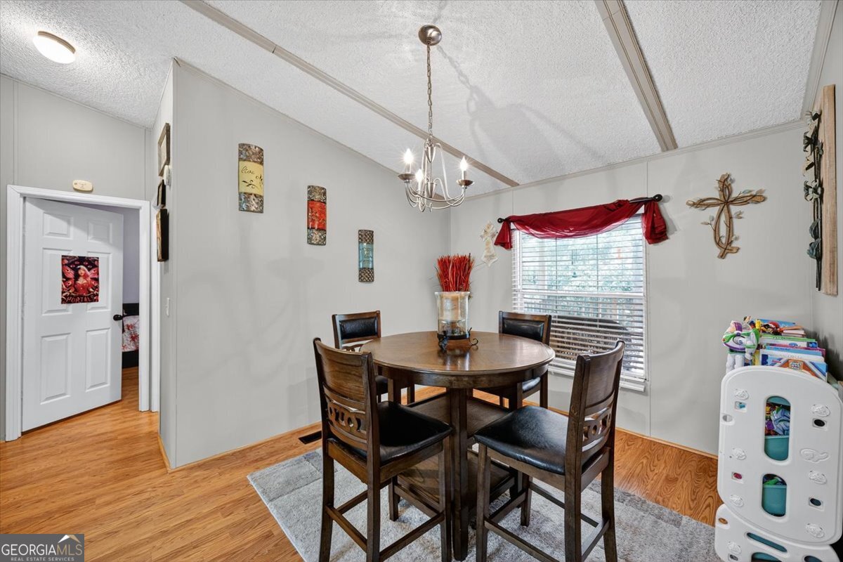 1659 Henderson Road Macon, GA 31217 - Photo 12 of 44 a view of a dining room with furniture and wooden floor