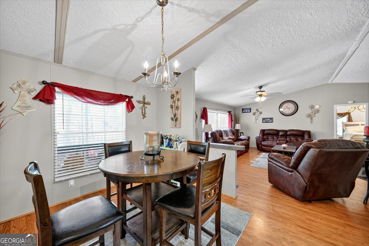 1659 Henderson Road Macon, GA 31217 - Photo 14 of 44 a view of a dining room with furniture and wooden floor