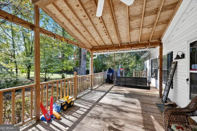 a view of a balcony with couch swing