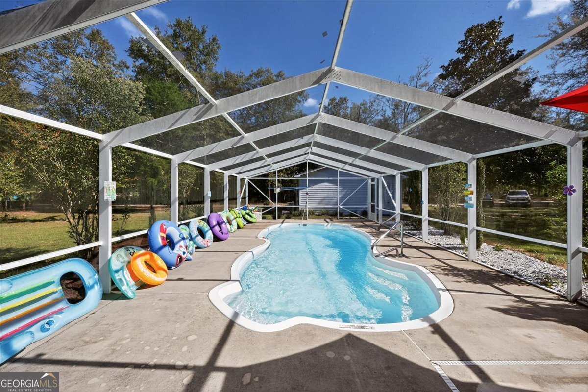 1659 Henderson Road Macon, GA 31217 - Photo 29 of 44 a view of a chairs and table in the patio