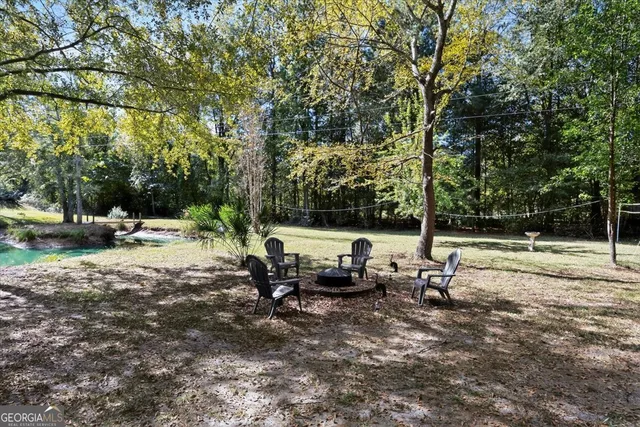 a backyard of a house with a tree