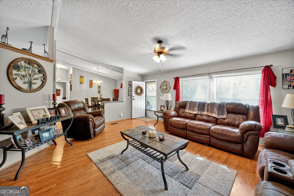 1659 Henderson Road Macon, GA 31217 - Photo 6 of 44 a living room with furniture a rug and a window