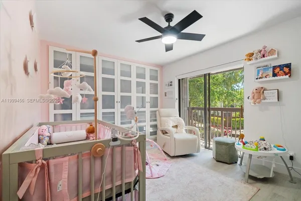 a bedroom with furniture and a potted plant