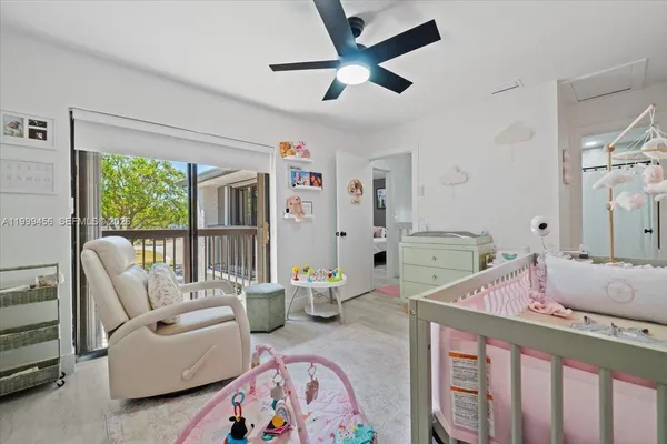 a large bed sitting in a bedroom next to a bathroom