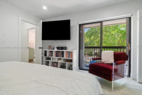 a bedroom with a bed and a view of bedroom