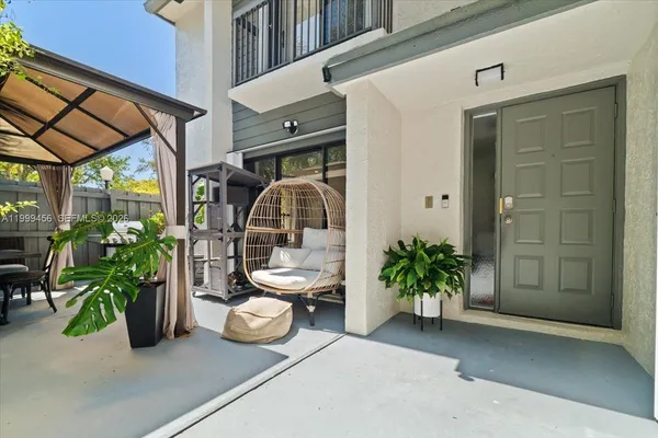a view of a dining tables and chairs in patio
