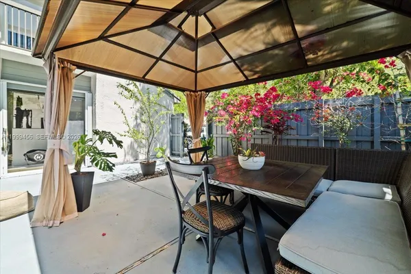 a view of a house with a small yard and plants