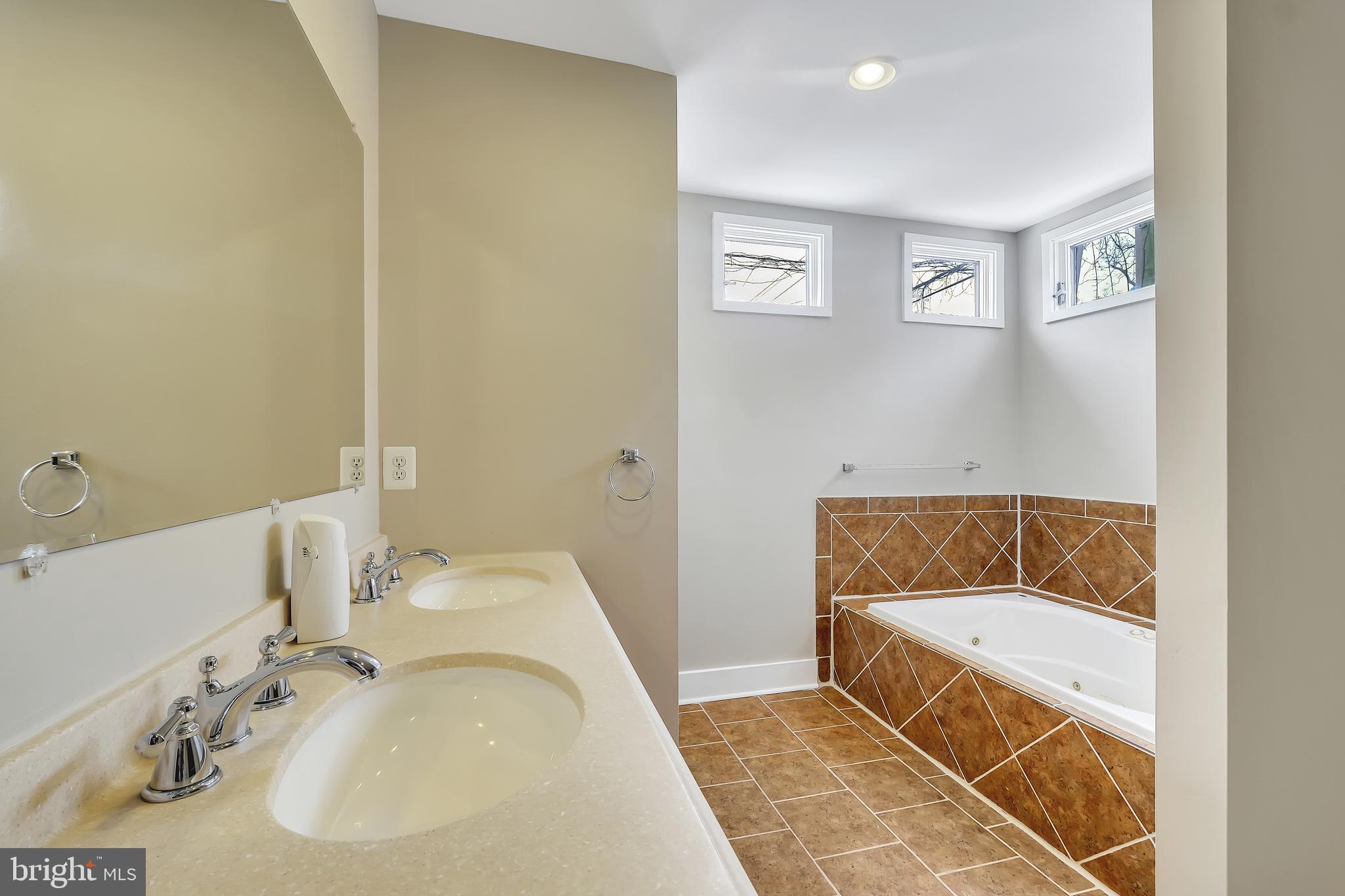 3504 Edgewood Road Baltimore, MD 21215 - Photo 17 of 60 a bathroom with a sink and a bathtub
