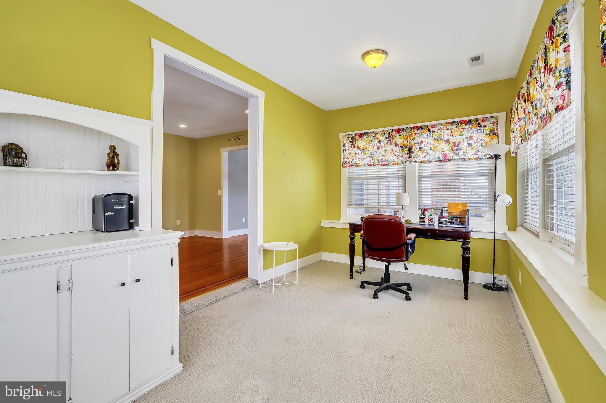 3504 Edgewood Road Baltimore, MD 21215 - Photo 26 of 60 a living room with furniture and a large window