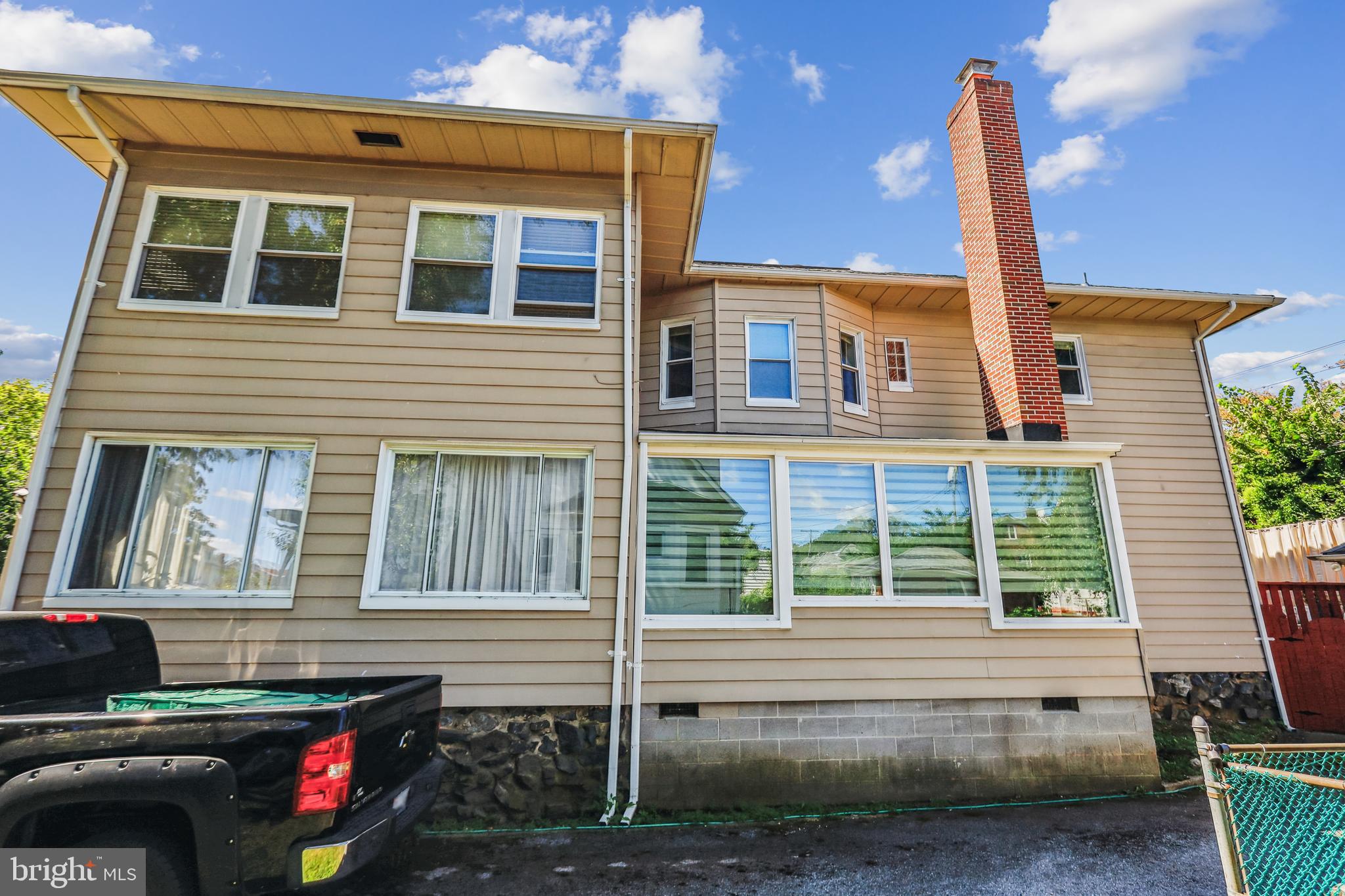 3504 Edgewood Road Baltimore, MD 21215 - Photo 56 of 60 a front view of a house with a yard
