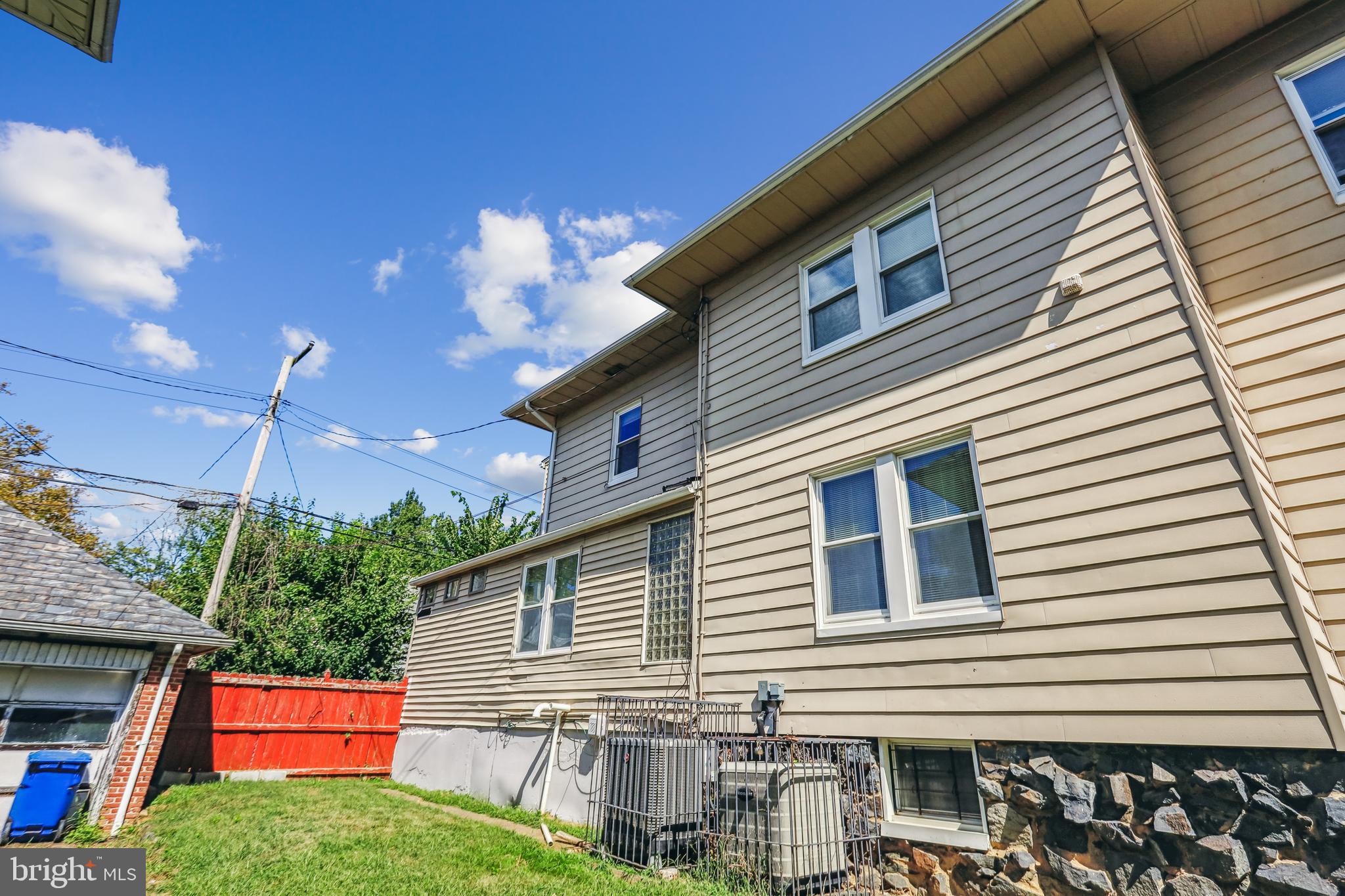 3504 Edgewood Road Baltimore, MD 21215 - Photo 57 of 60 a front view of a house with yard and garage