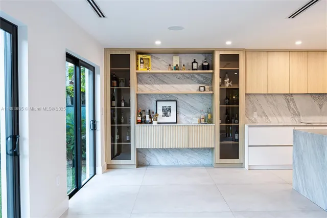 a view of kitchen with refrigerator and window