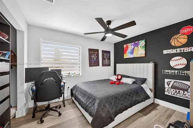 a bedroom with a bed and dresser