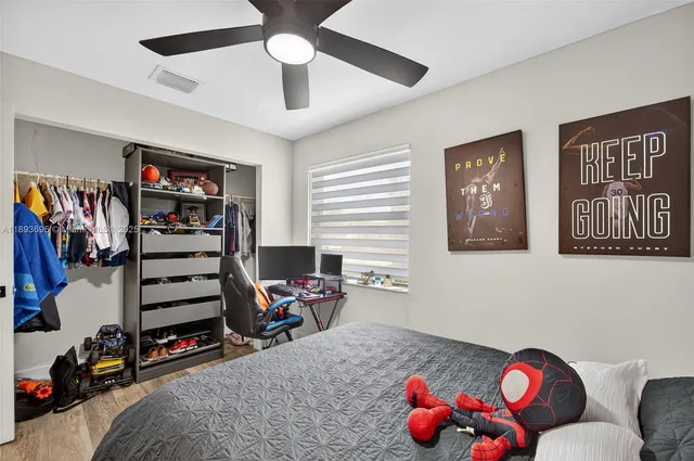 a view of a livingroom with furniture and closet