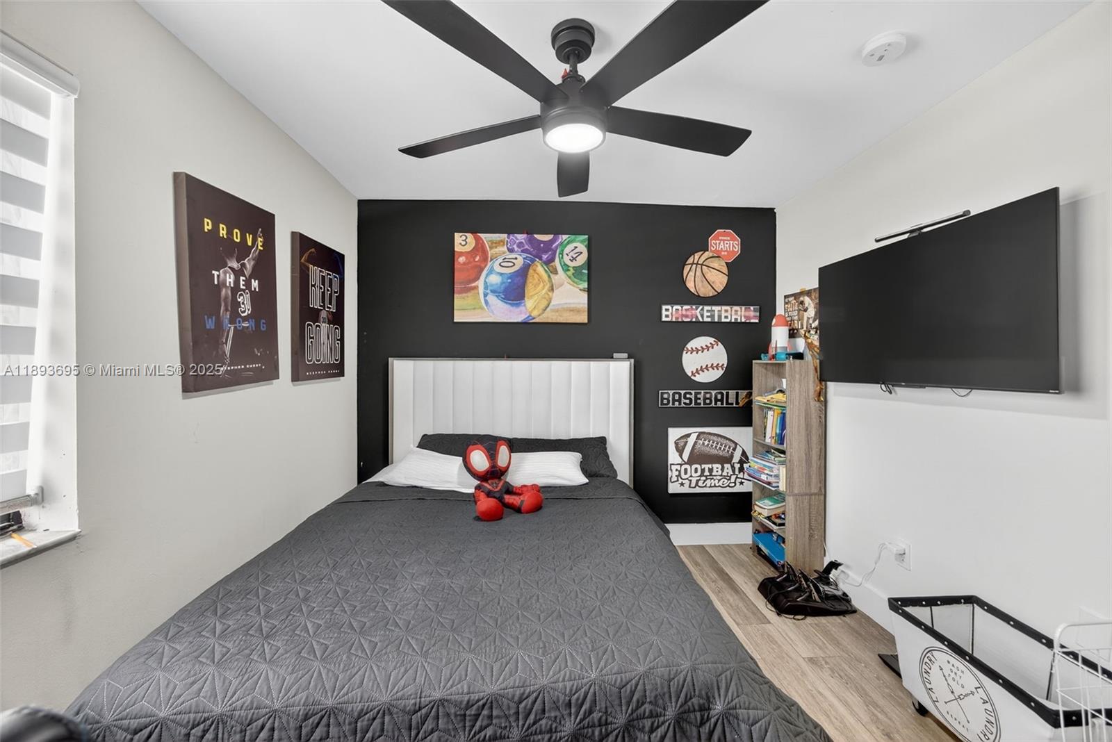 25796 Southwest 123rd Avenue Homestead, FL 33032 - Photo 17 of 26 a bedroom with furniture and a flat screen tv