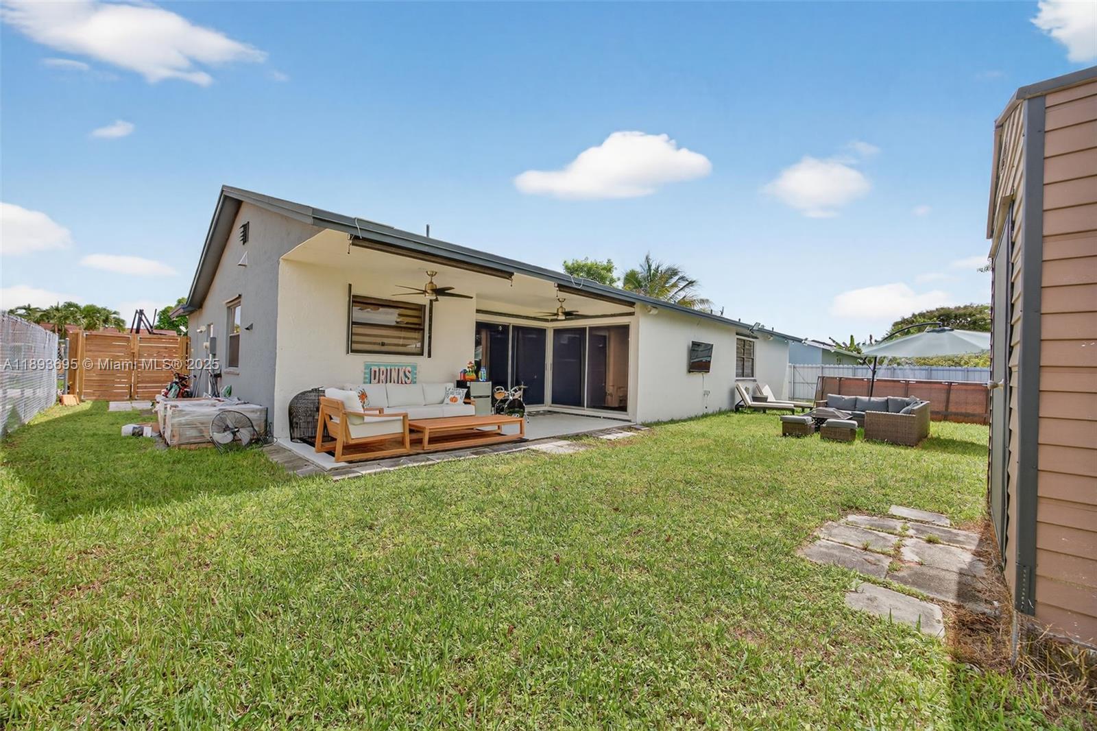 25796 Southwest 123rd Avenue Homestead, FL 33032 - Photo 24 of 26 a view of a house with backyard