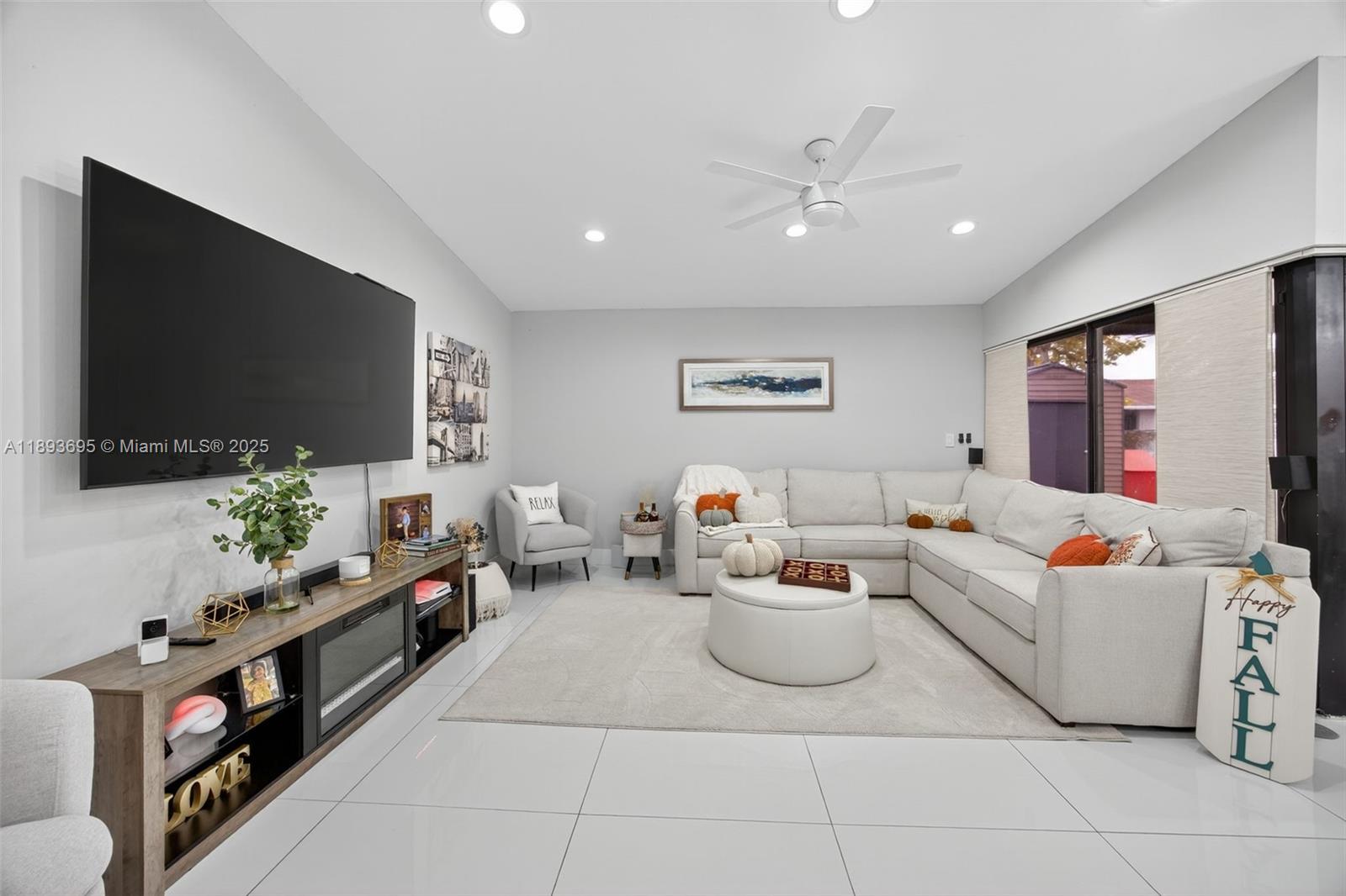 25796 Southwest 123rd Avenue Homestead, FL 33032 - Photo 4 of 26 a living room with furniture and a flat screen tv