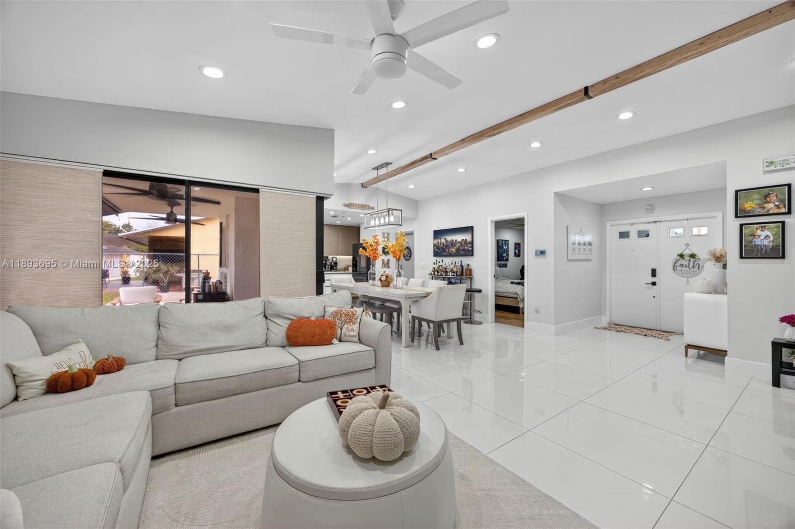 25796 Southwest 123rd Avenue Homestead, FL 33032 - Photo 5 of 26 a living room with furniture and white walls