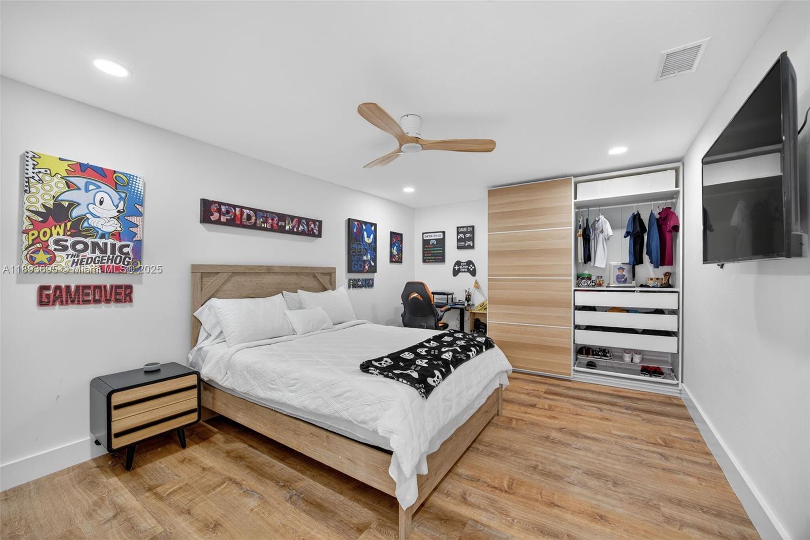 25796 Southwest 123rd Avenue Homestead, FL 33032 - Photo 10 of 26 a living room with furniture and a flat screen tv