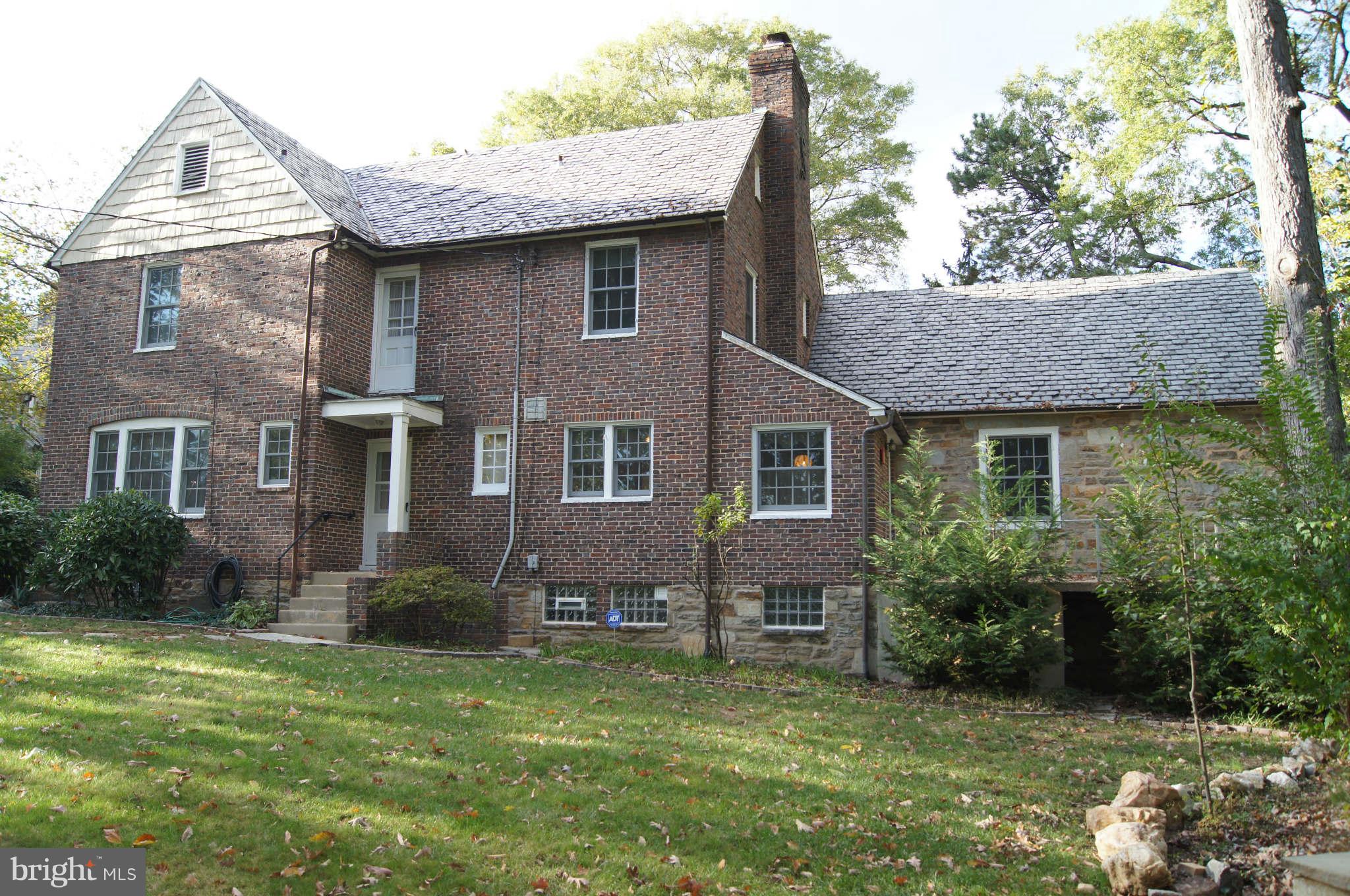 4001 Roundtop Road Baltimore, MD 21218 - Photo 2 of 30 Brick, stone and cedar shingle compose the ext.