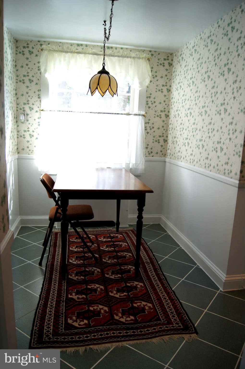 4001 Roundtop Road Baltimore, MD 21218 - Photo 14 of 30 Separate breakfast room leads to raised patio