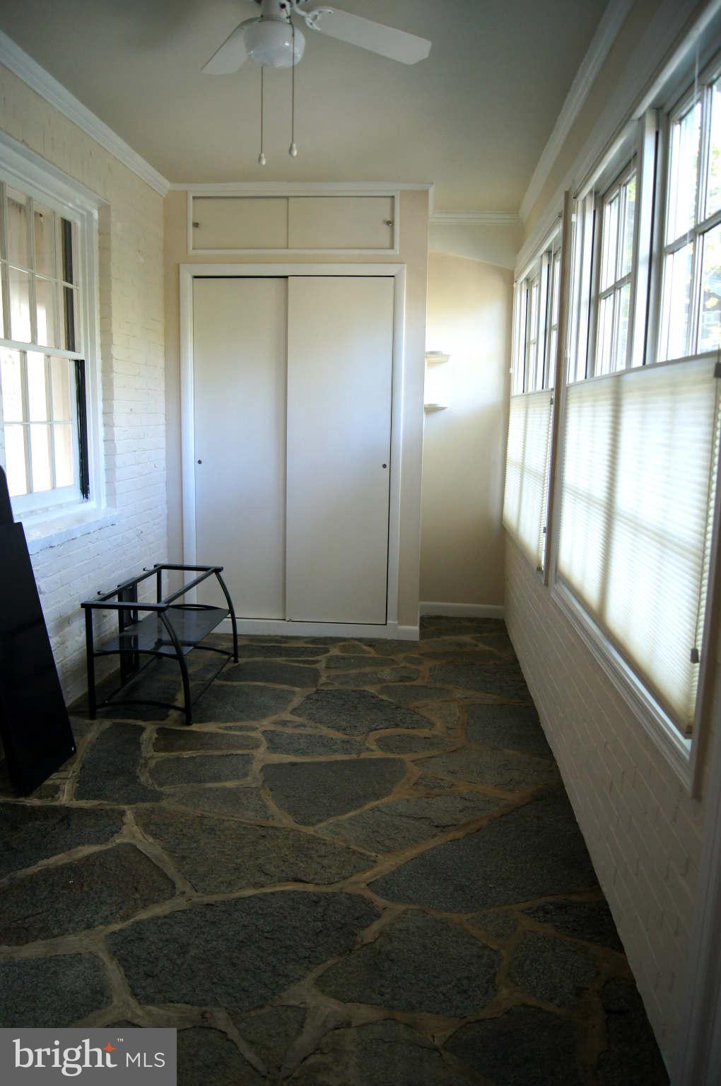 4001 Roundtop Road Baltimore, MD 21218 - Photo 3 of 30 Den or sunroom was orig a porch. Flagstone floor.