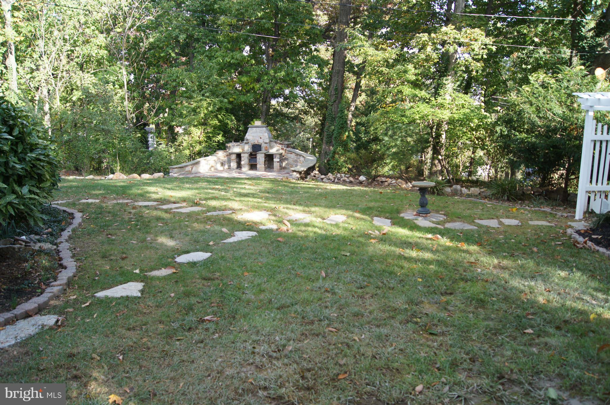 4001 Roundtop Road Baltimore, MD 21218 - Photo 28 of 30 Huge level yard. Pathways, stone walls, more