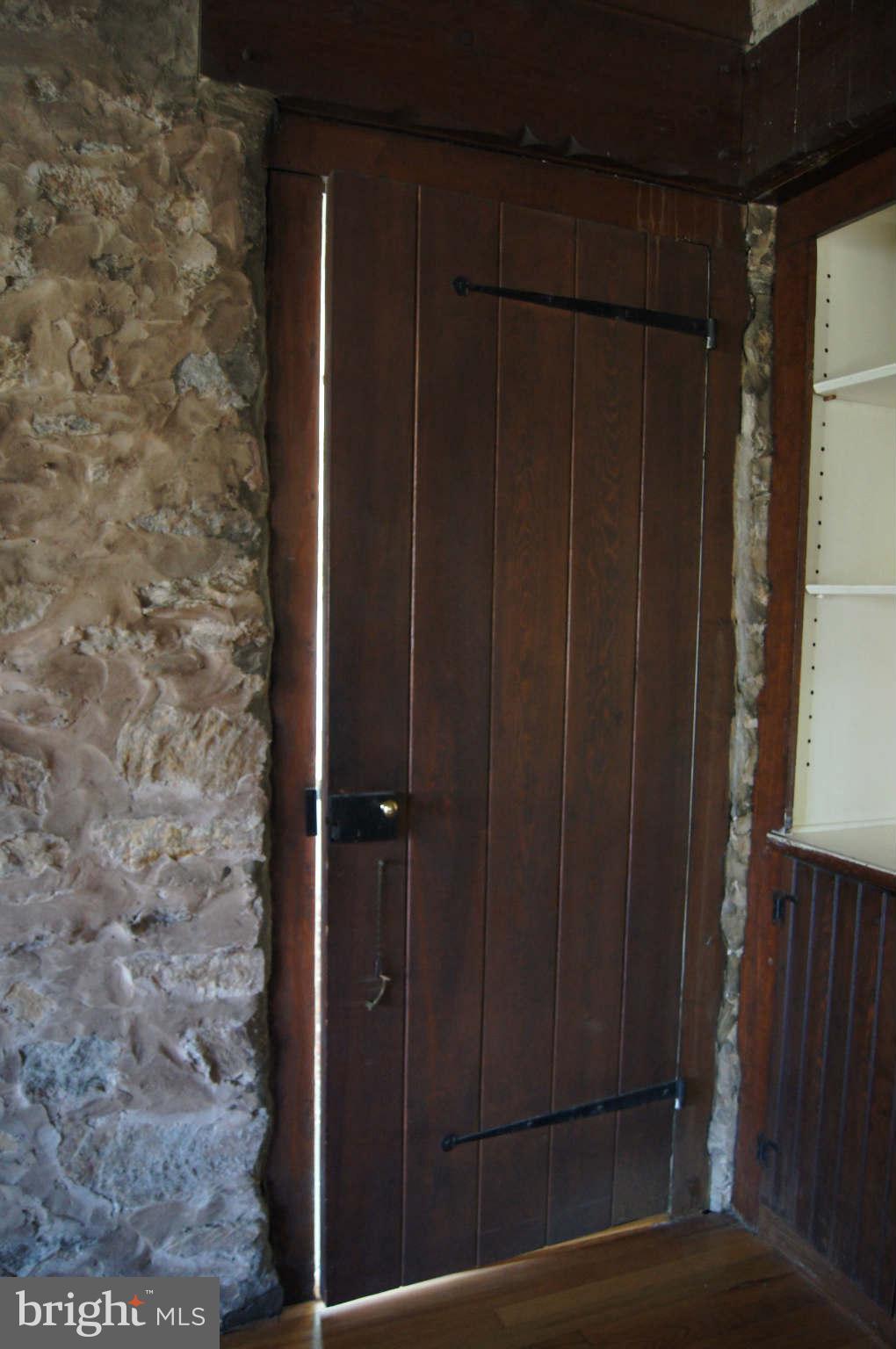 4001 Roundtop Road Baltimore, MD 21218 - Photo 7 of 30 Original ship's door reclaimed to family room.