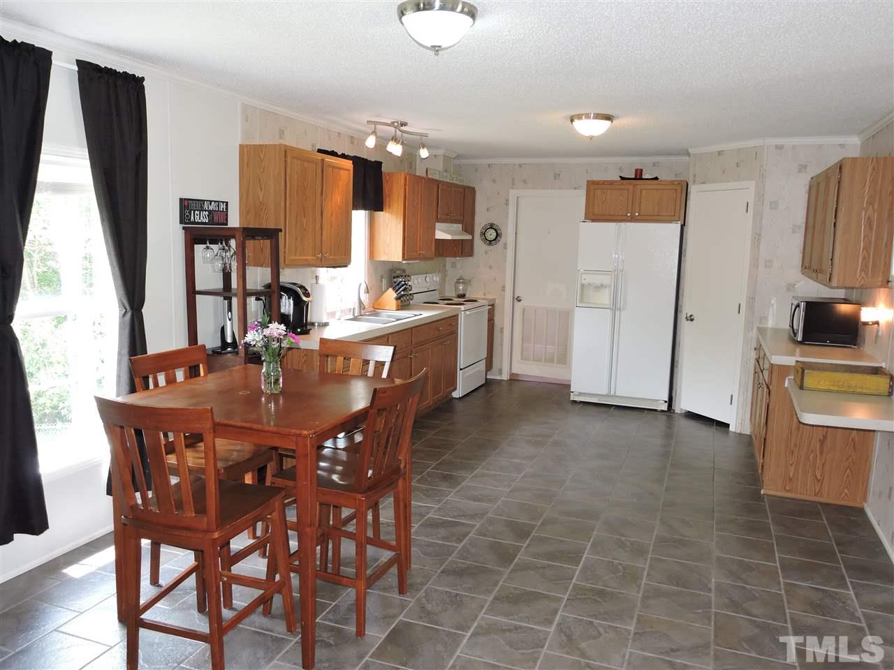 511 Christys Way Roxboro, NC 27574 - Photo 7 of 18 a view of a dining room with furniture