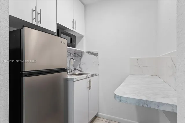 a close view of a refrigerator in kitchen and a refrigerator